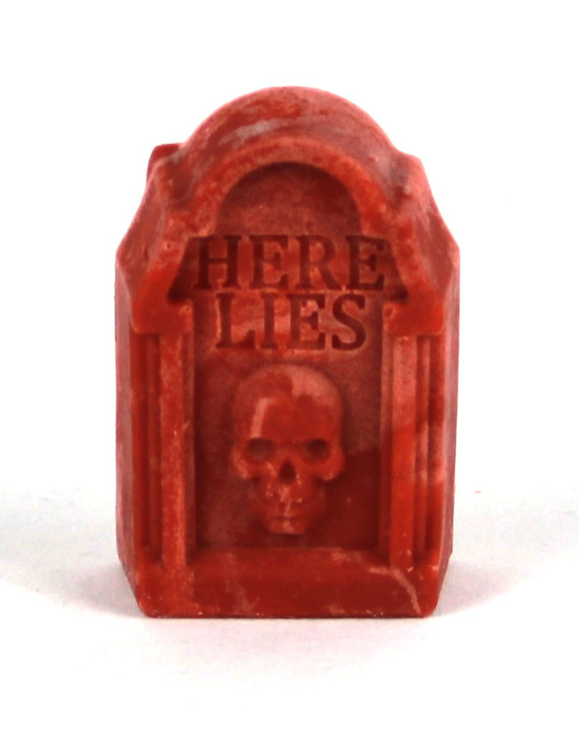 Tombstone reads "Here Lies", skull beneath inscription