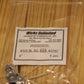 A clear plastic zip-top bag containing five six inch pre-tabbed wicks, with a white paper label from Wicks Unlimited, placed on a light wood surface.