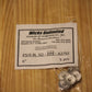 A clear plastic zip-top bag containing five six inch pre-tabbed wicks next to a white paper label that reads 'Wicks Unlimited' and shows product details, placed on a light wood surface.