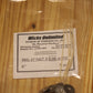 A clear plastic zip-top bag containing five six inch pre-tabbed wicks, placed on a light wood surface.