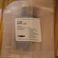 A packaged woodenwick tube product labeled 'TUBE WICK .01' by The Wooden Wick Co.