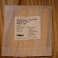 A package of 'The Wooden Wick Co.' Daffodil Yellow single-ply wood wicks.
