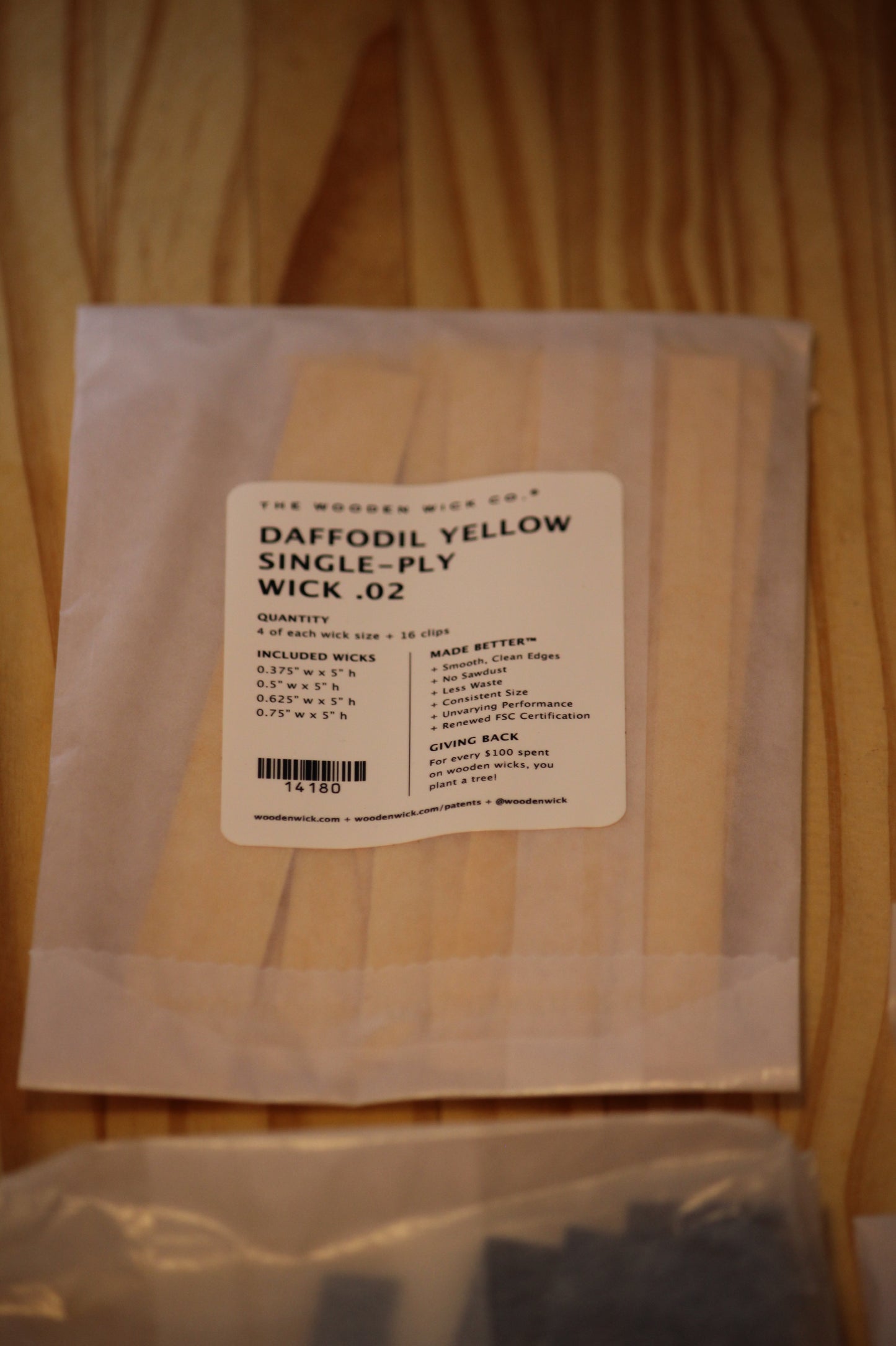 A package of 'The Wooden Wick Co.' Daffodil Yellow single-ply wood wicks.