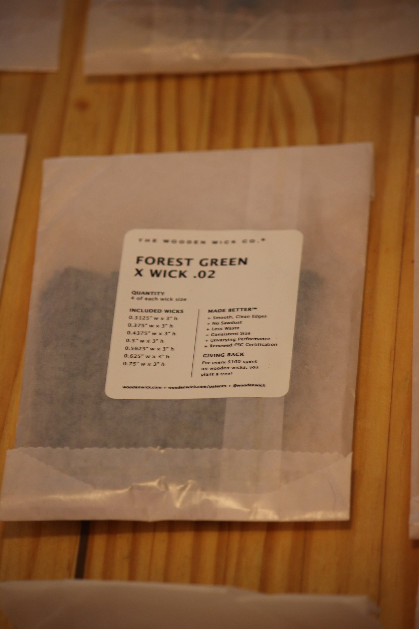 A package of wood wicks, specifically 'Forest Green X Wick .02' by The Wooden Wick Co.