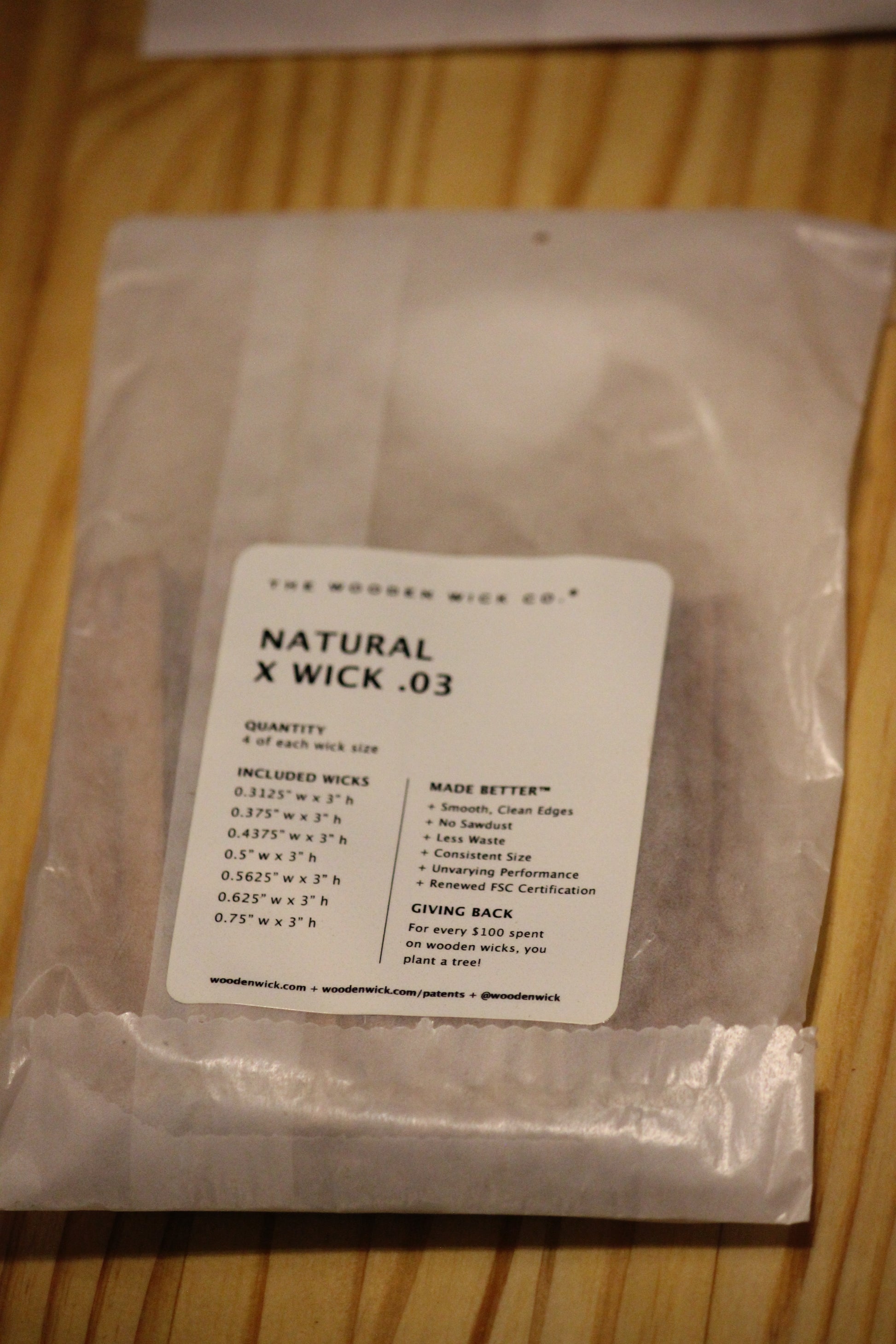 A clear plastic bag of The Wooden Wick Co. Natural X Wick .