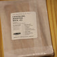A package of wood wicks by The Wooden Wick Co. labeled 'Crackling Booster Wick .