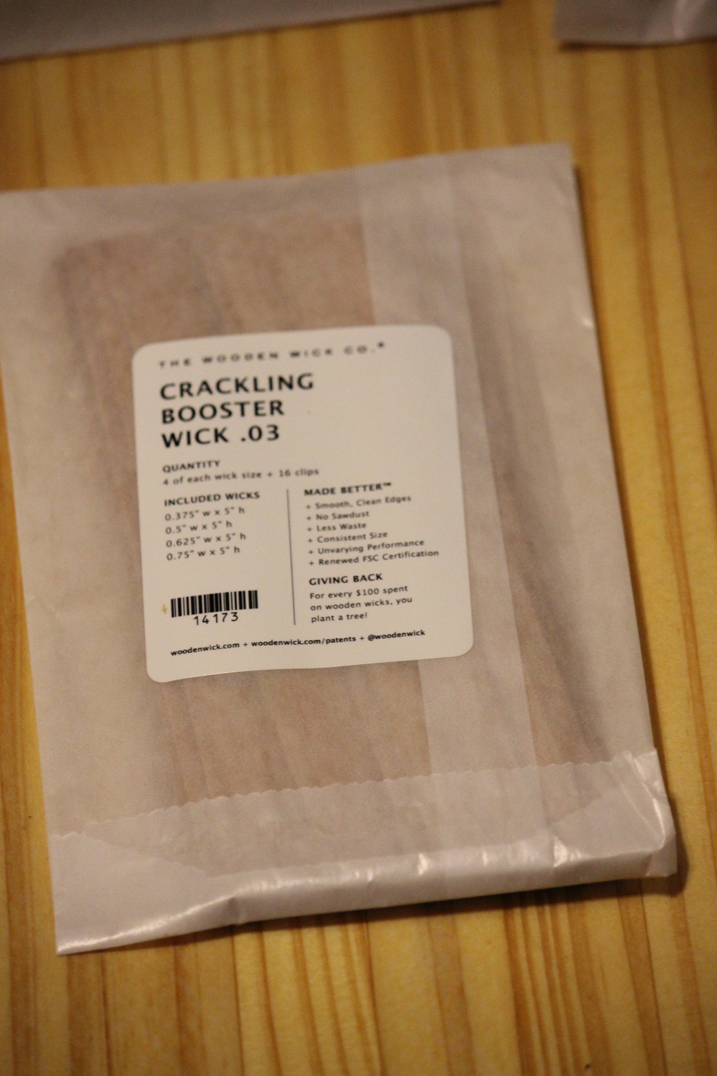 A package of wood wicks by The Wooden Wick Co. labeled 'Crackling Booster Wick .