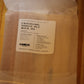A clear plastic bag containing crackling single ply wood wicks, with a white label showing the brand 'The Wooden Wick Co.
