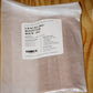 A sealed white plastic bag of The Wicked Wick Co. Crackling Booster Wicks.