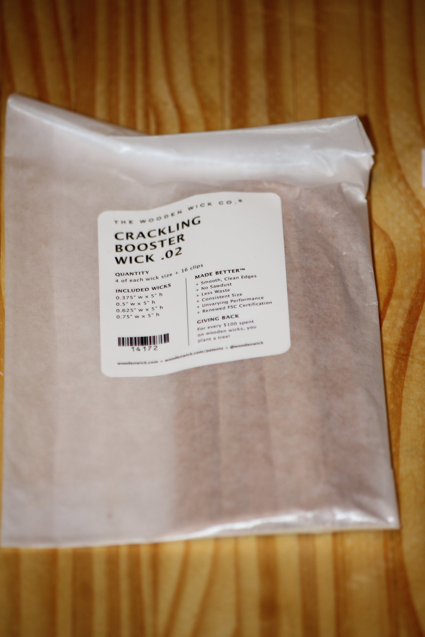 A sealed white plastic bag of The Wicked Wick Co. Crackling Booster Wicks.