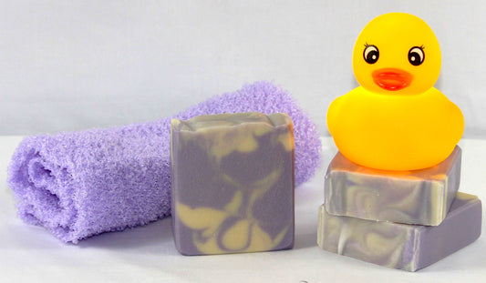 Lilacs for Louise shown with purple exfoliating towel and rubber ducky